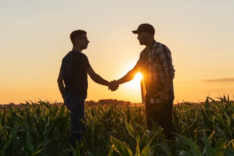 Two farmers shaking hands