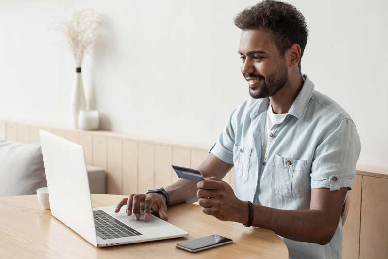 A man making a payment online with his credit card