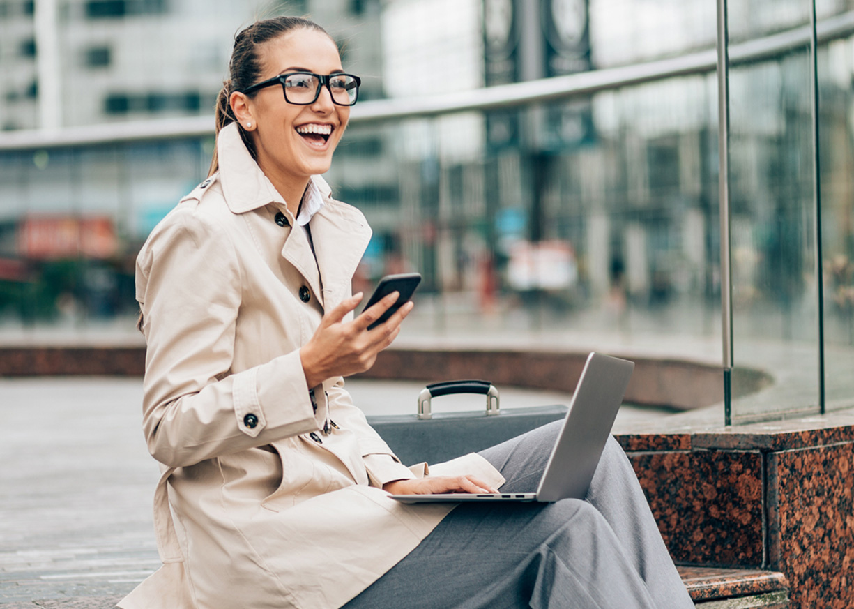 A business woman on her mobile device