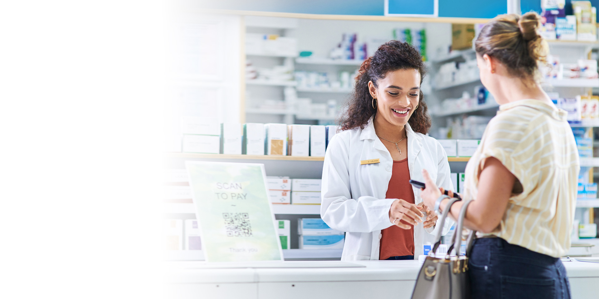 A pharmacist helping a client