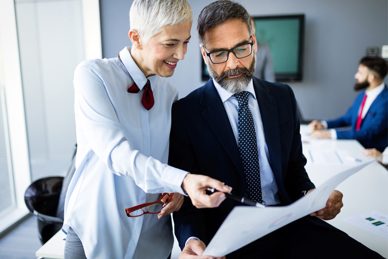 Two associates looking at a company's financials