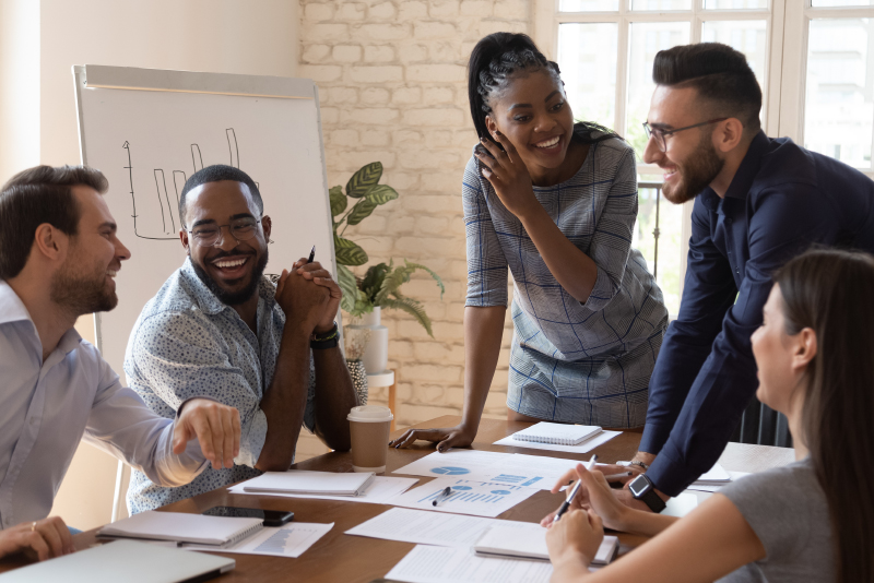 A group of coworkers have a meeting regarding a project