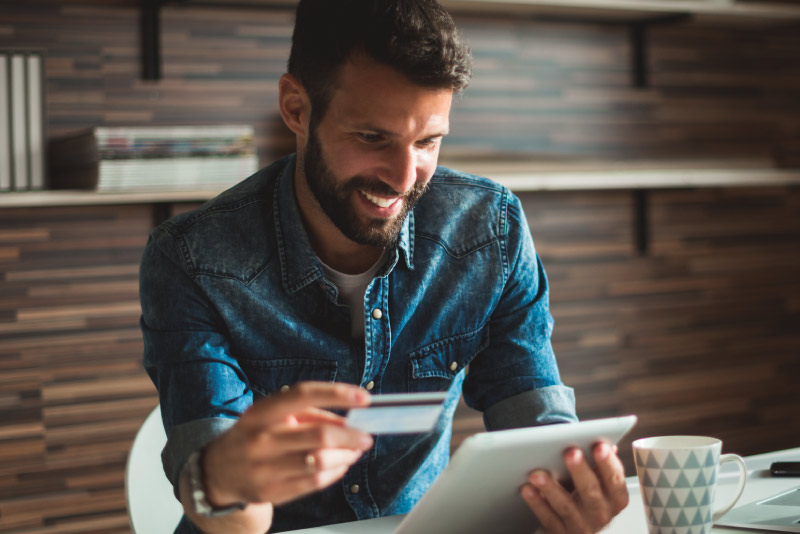 A man adding his card on his payment site