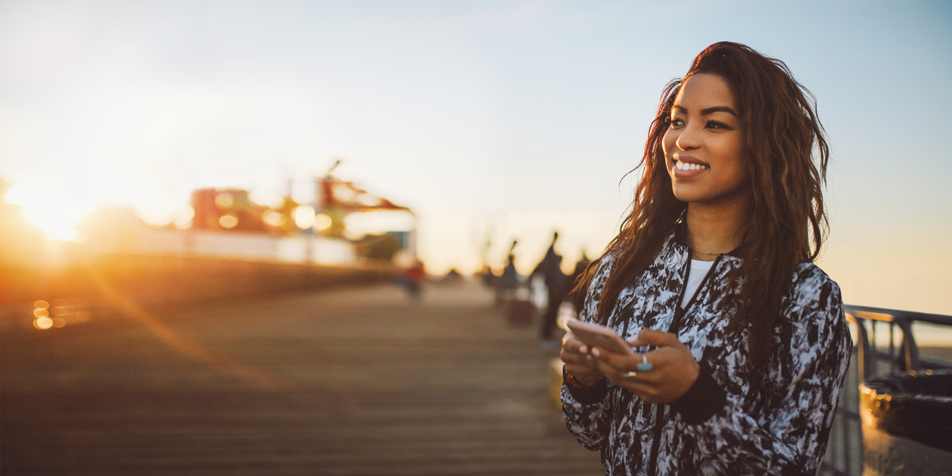 A woman accessing her account on her mobile device