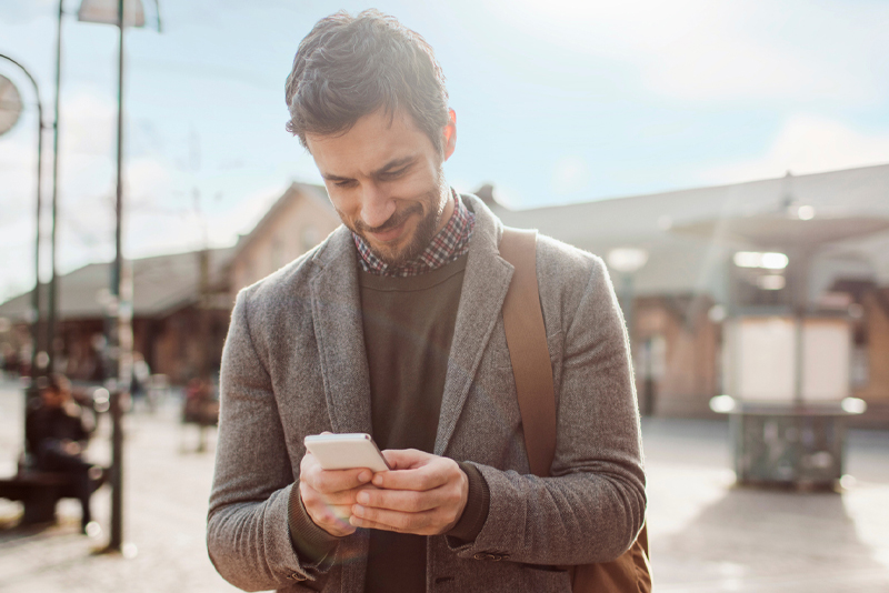 A man checking his banking account from his mobile device