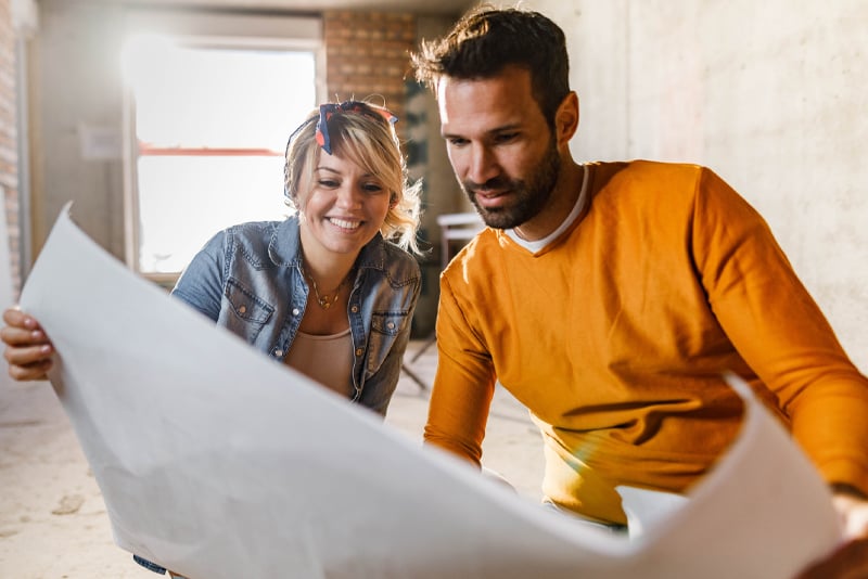 A couple looking at their home remodeling project