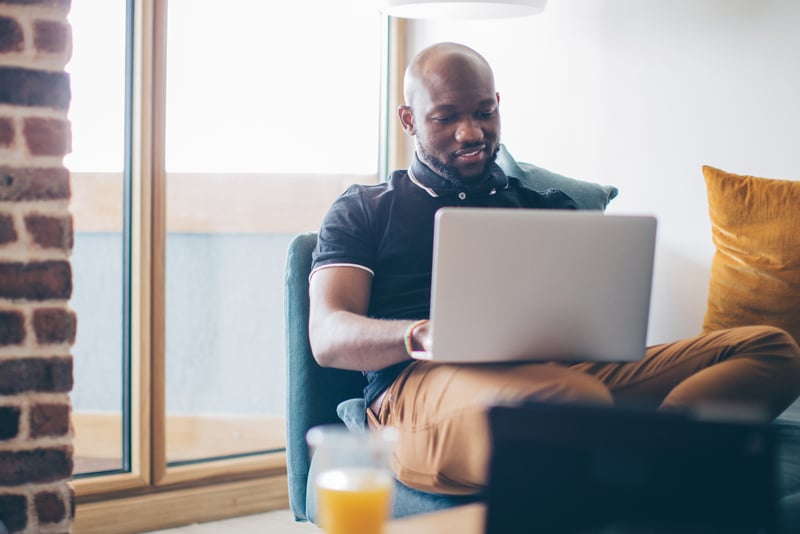 A man looking online for a new loan