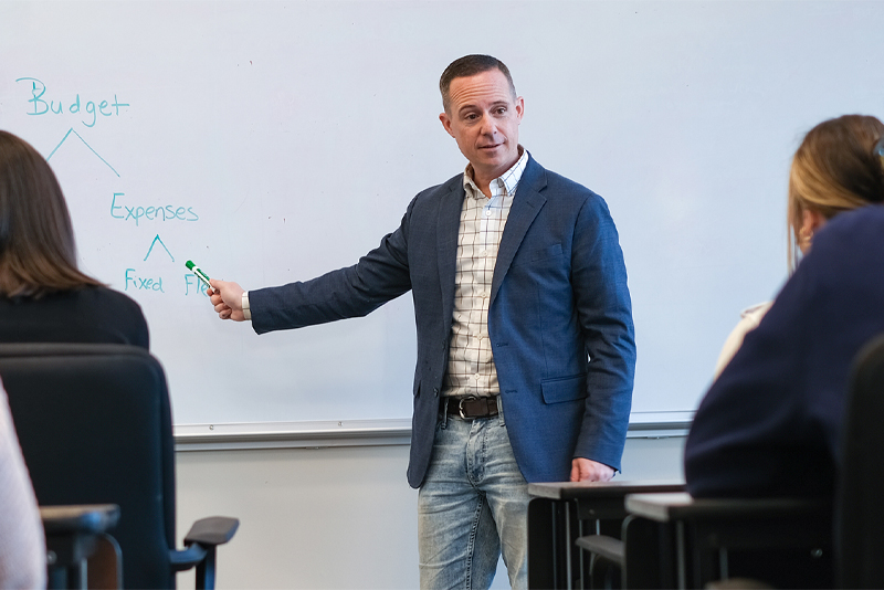 A man conducting financial education