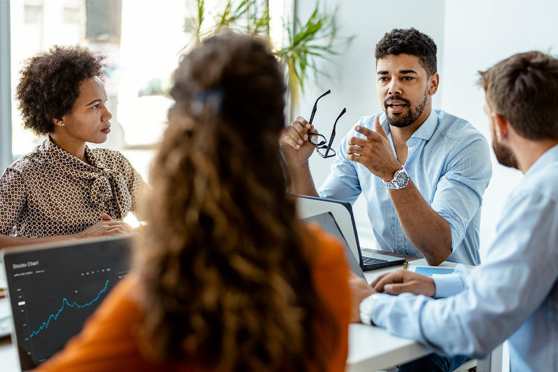 Team members meeting together with clients