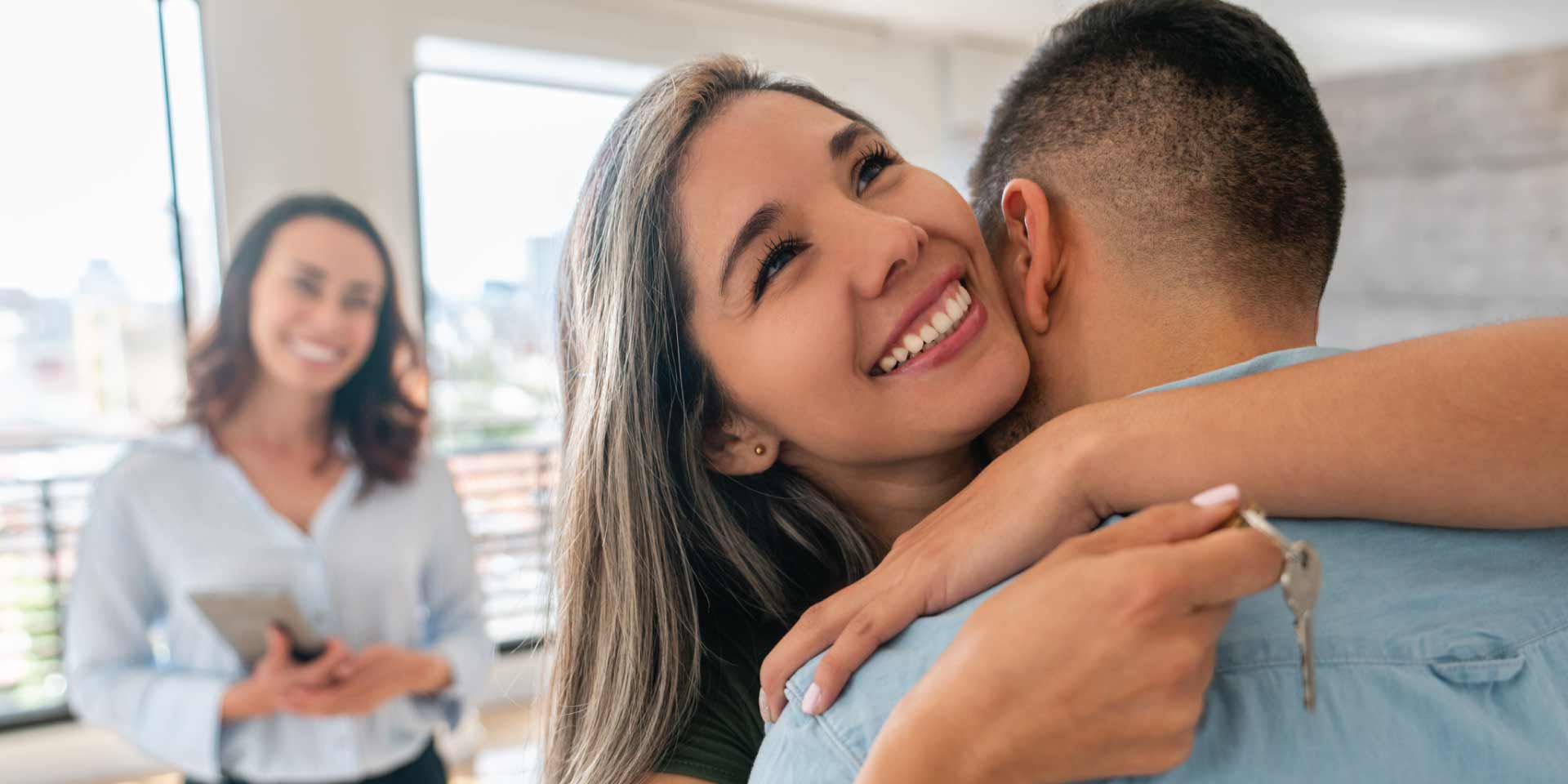 A couple getting the keys to their first home