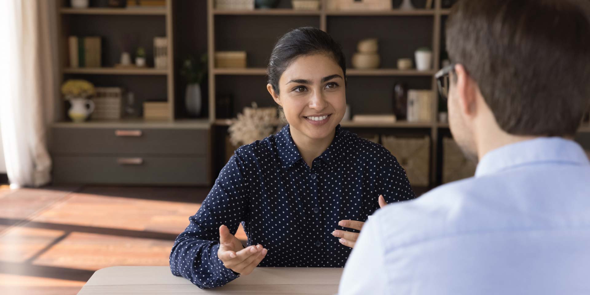 A new client talking with a lender about wanting to purchase a new home