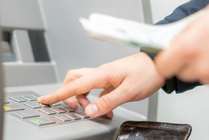 A client getting money out of the ATM