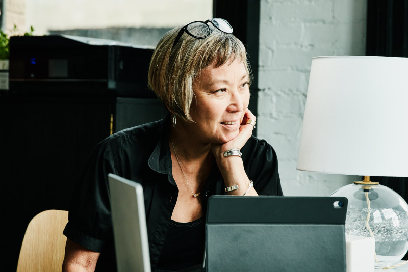 A small business owner at her computer desk