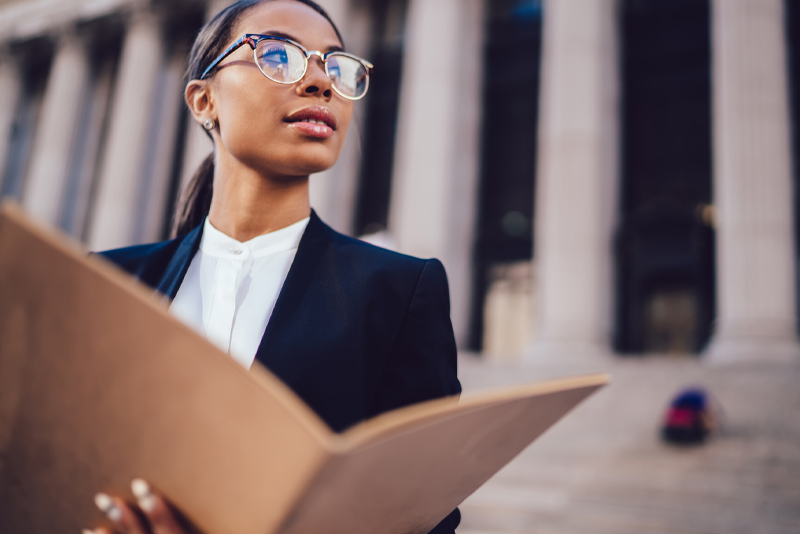 A woman outside a federal building