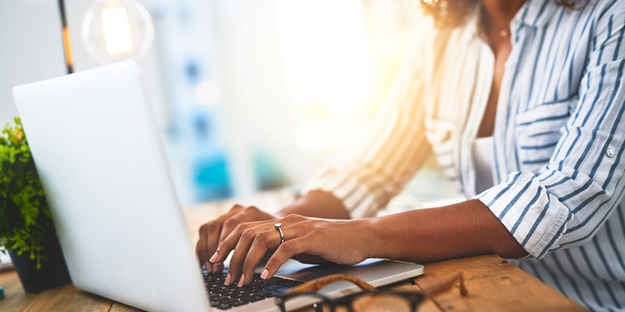 Woman searching for PPP forgiveness information on her laptop