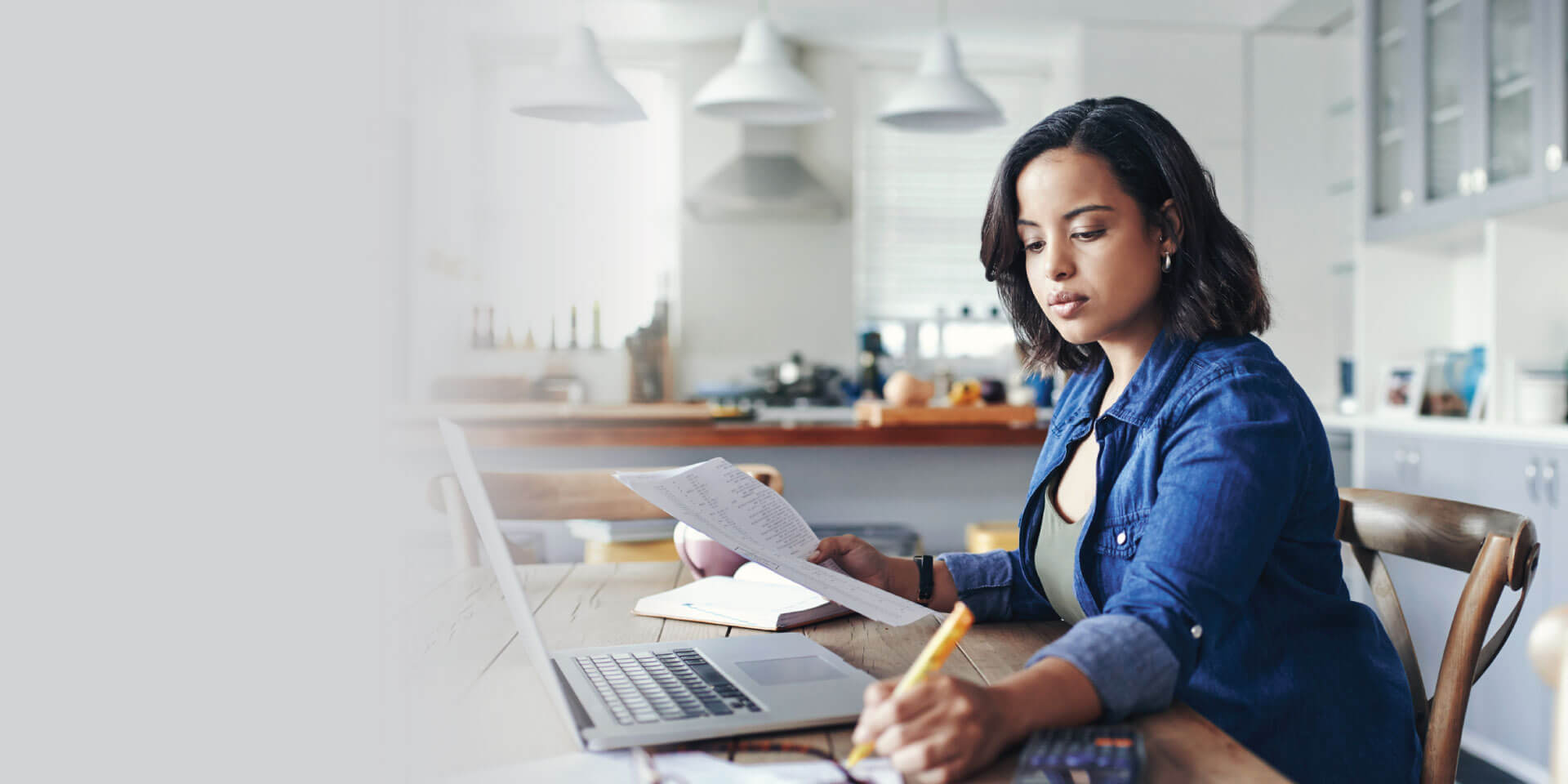 A woman looking through her finances