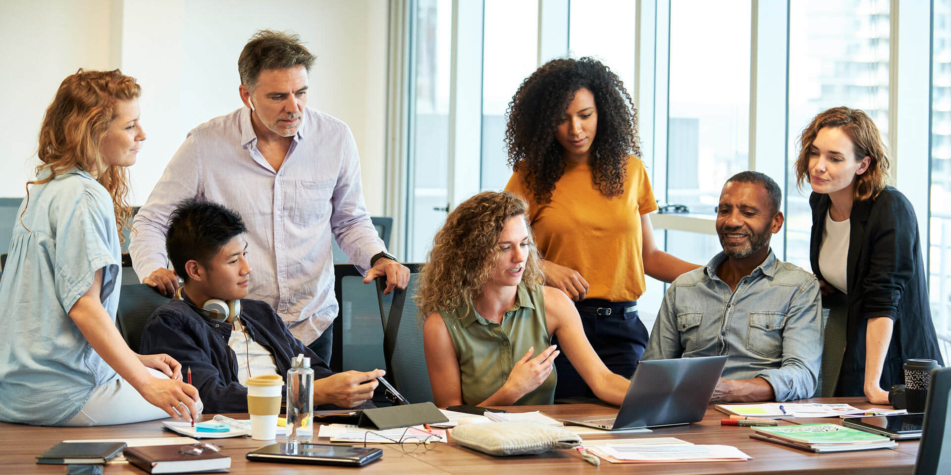 A group of coworkers gathering for a meeting