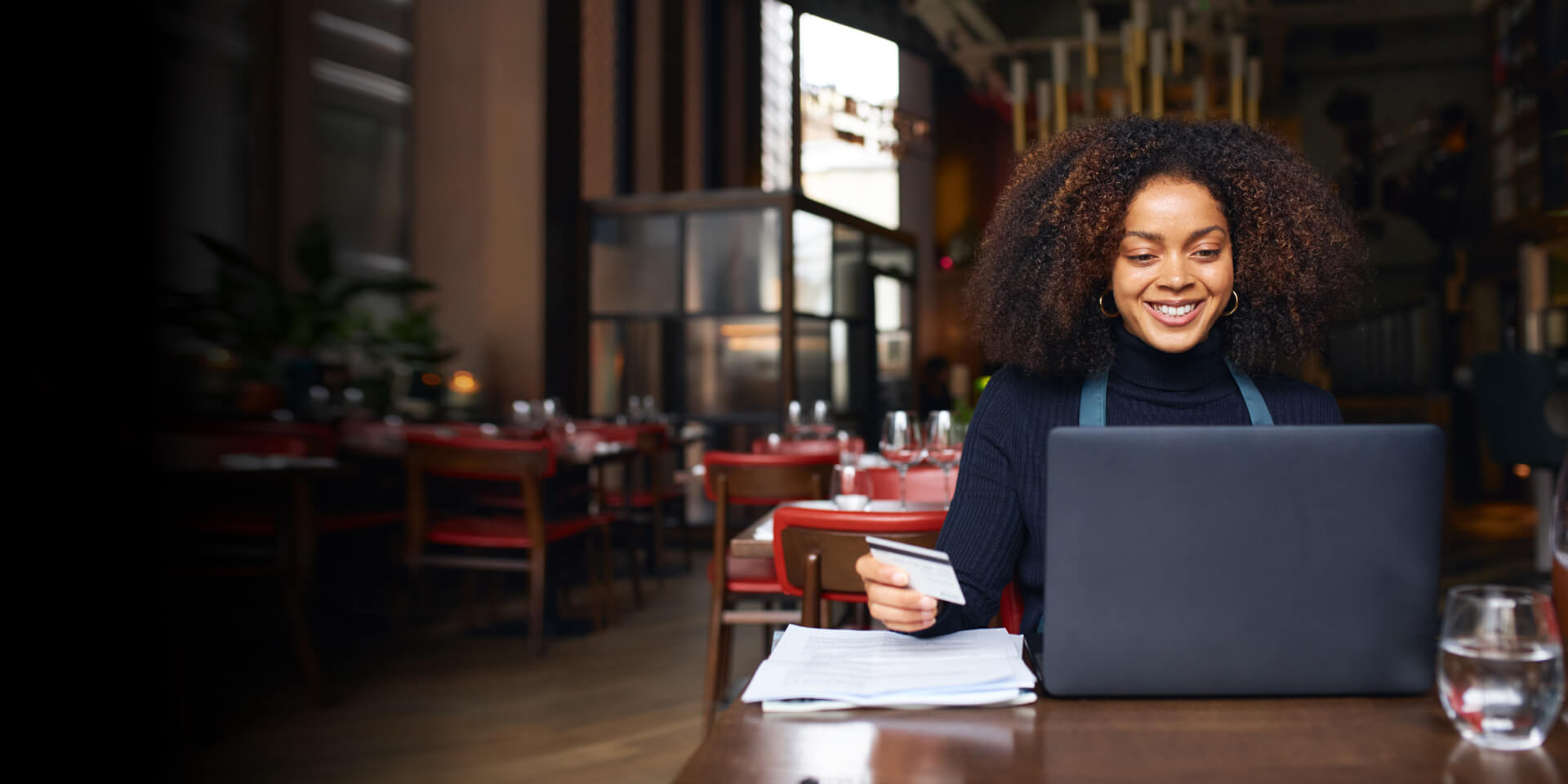 A business owner purchasing more items for her restaurant