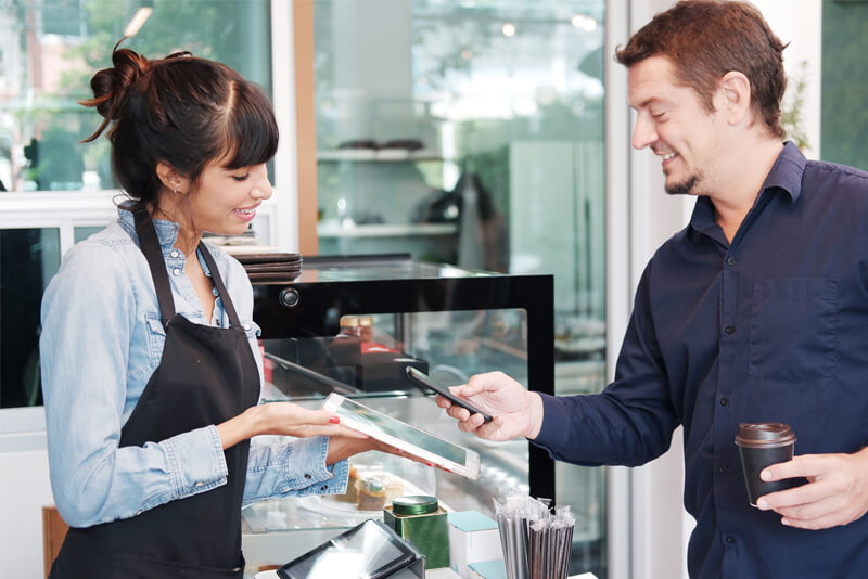 A man paying with his mobile device