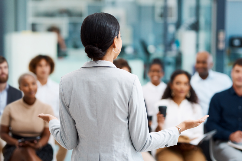 A trainer meeting with her associates