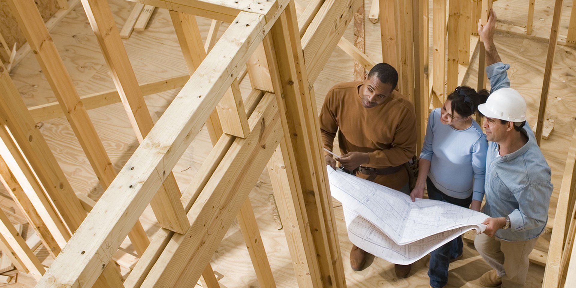 A family working on building their new home