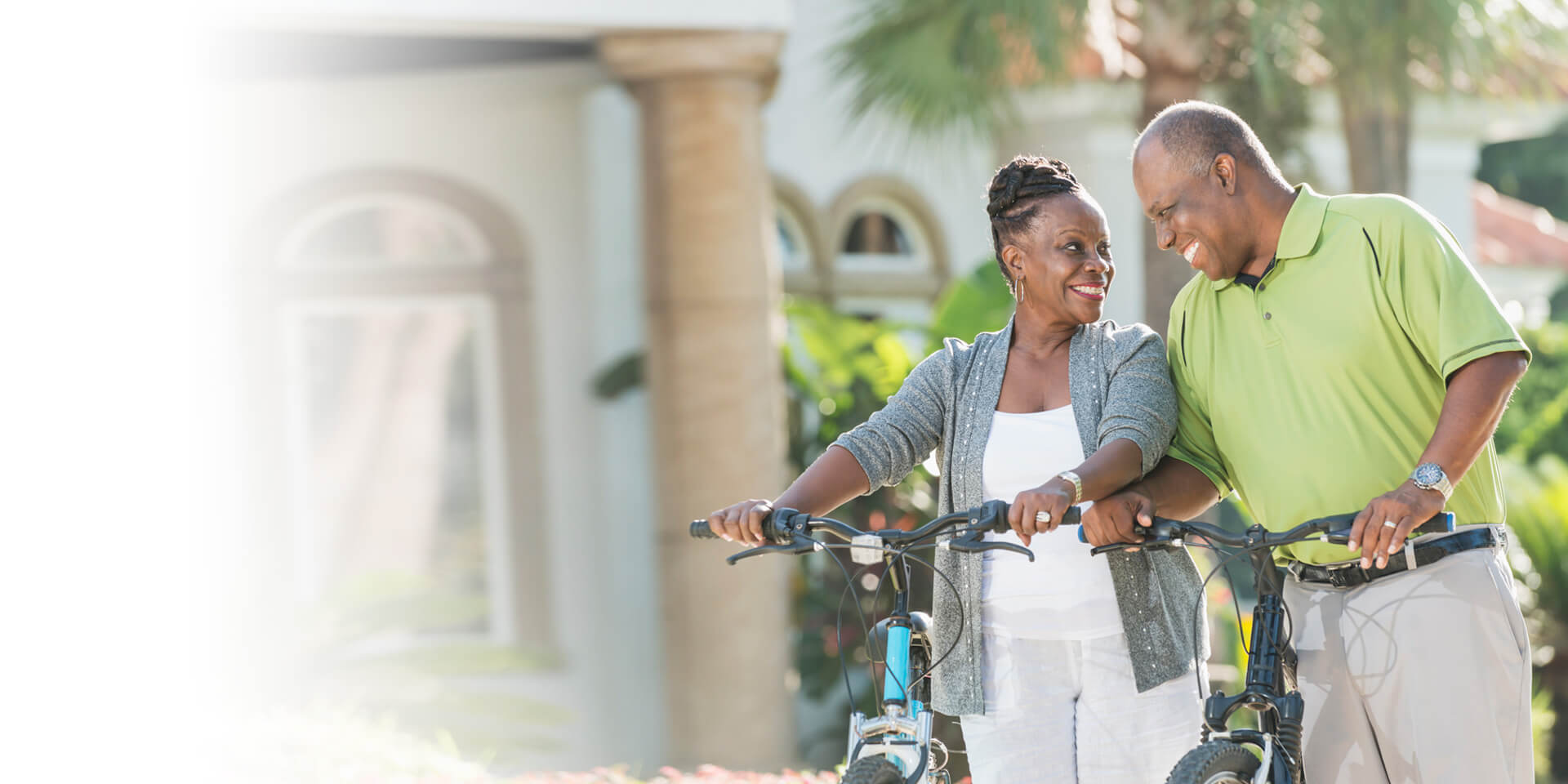 A couple outside on their bikes