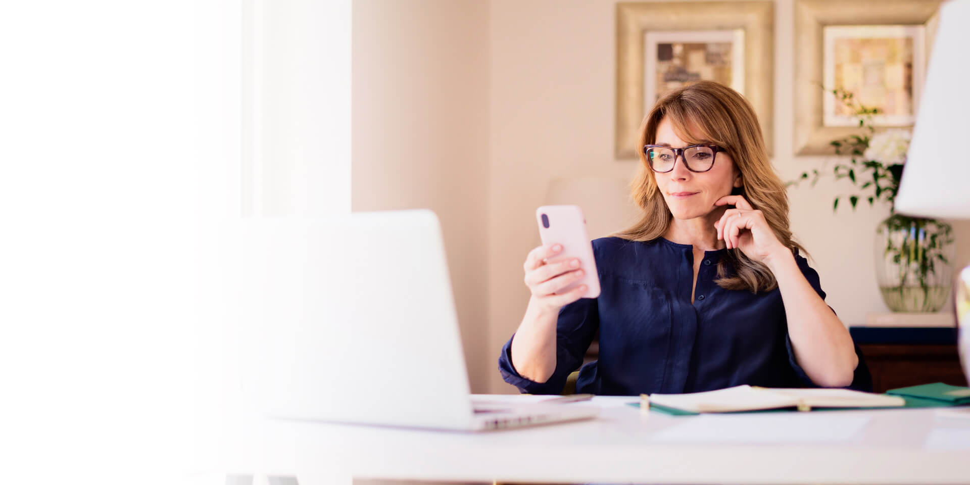 A woman checking her account information from her mobile device