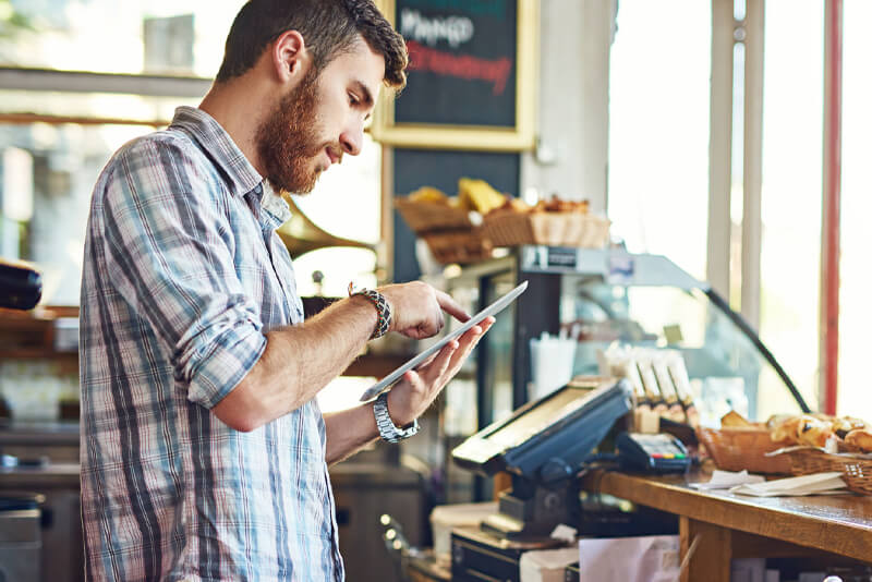 A small shop owner making an online payment