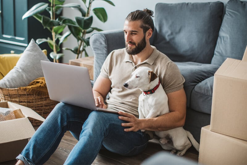 A man looking for a new home on his laptop