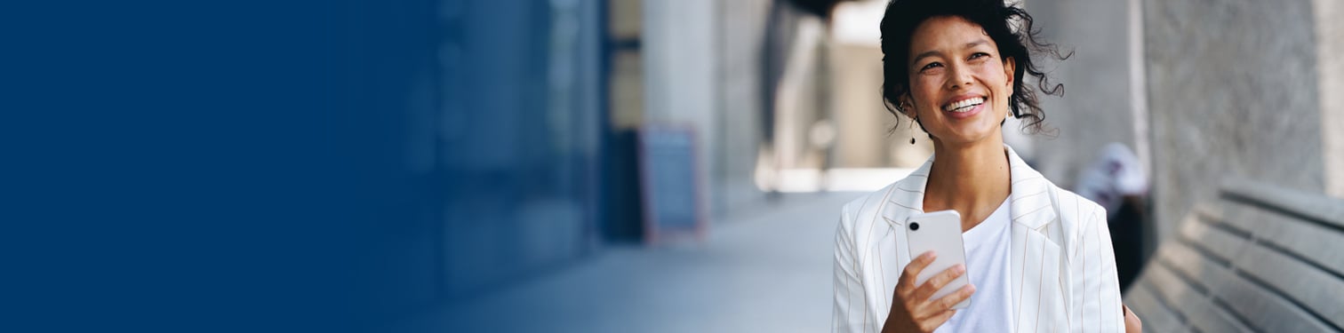 A woman walking and talking on her phone