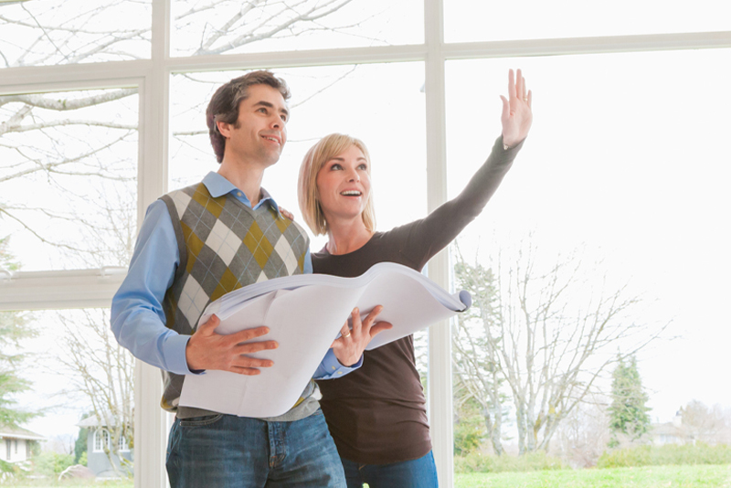 A couple looking at remodeling their new home