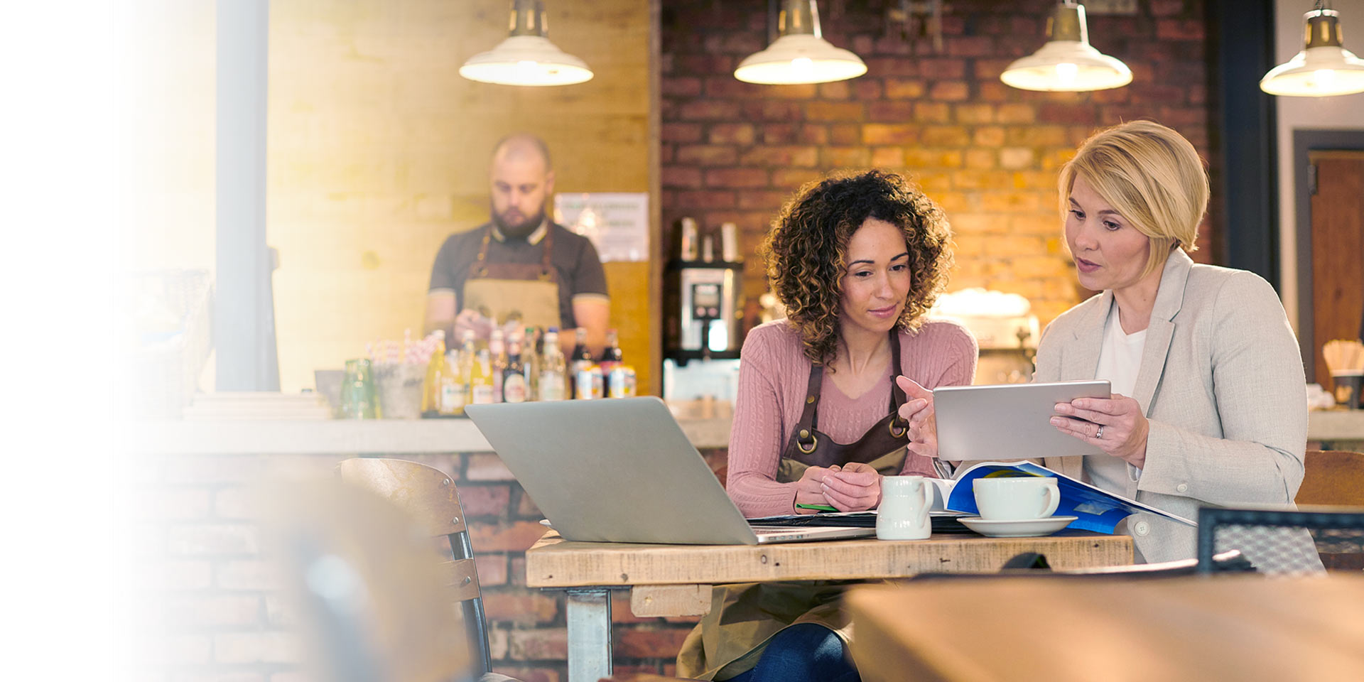 A business owner talking to a small business banker about a loan